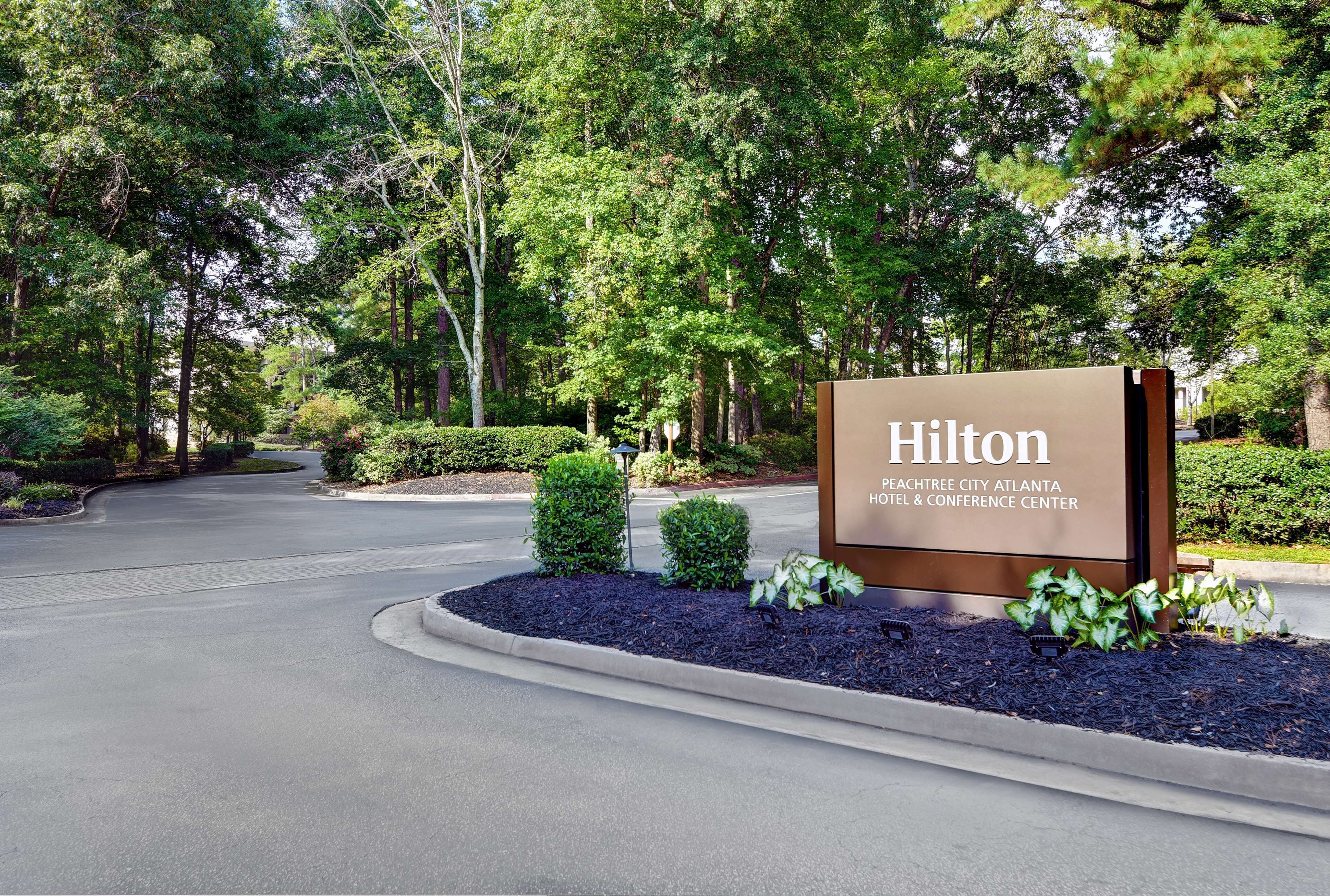 A sign for the Hilton Peachtree City Atlanta Hotel & Conference Center.