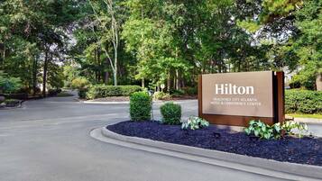 A sign for the Hilton Peachtree City Atlanta Hotel & Conference Center.