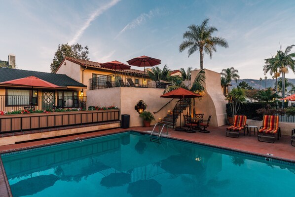 Outdoor pool, open 9:00 AM to 9:00 PM, pool umbrellas, pool loungers