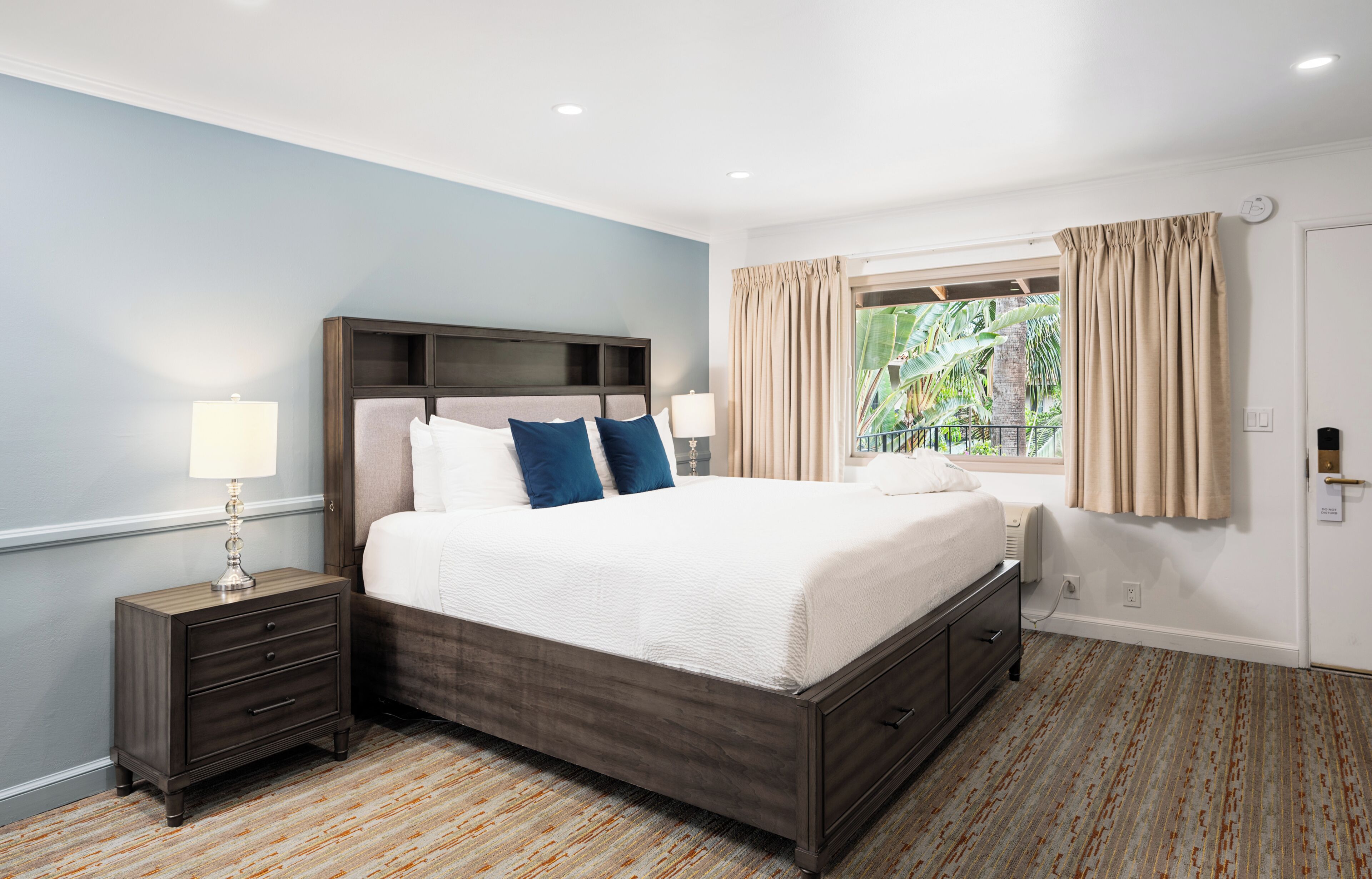 King Deluxe with Patio | Hypo-allergenic bedding available, in-room safe, desk, blackout drapes