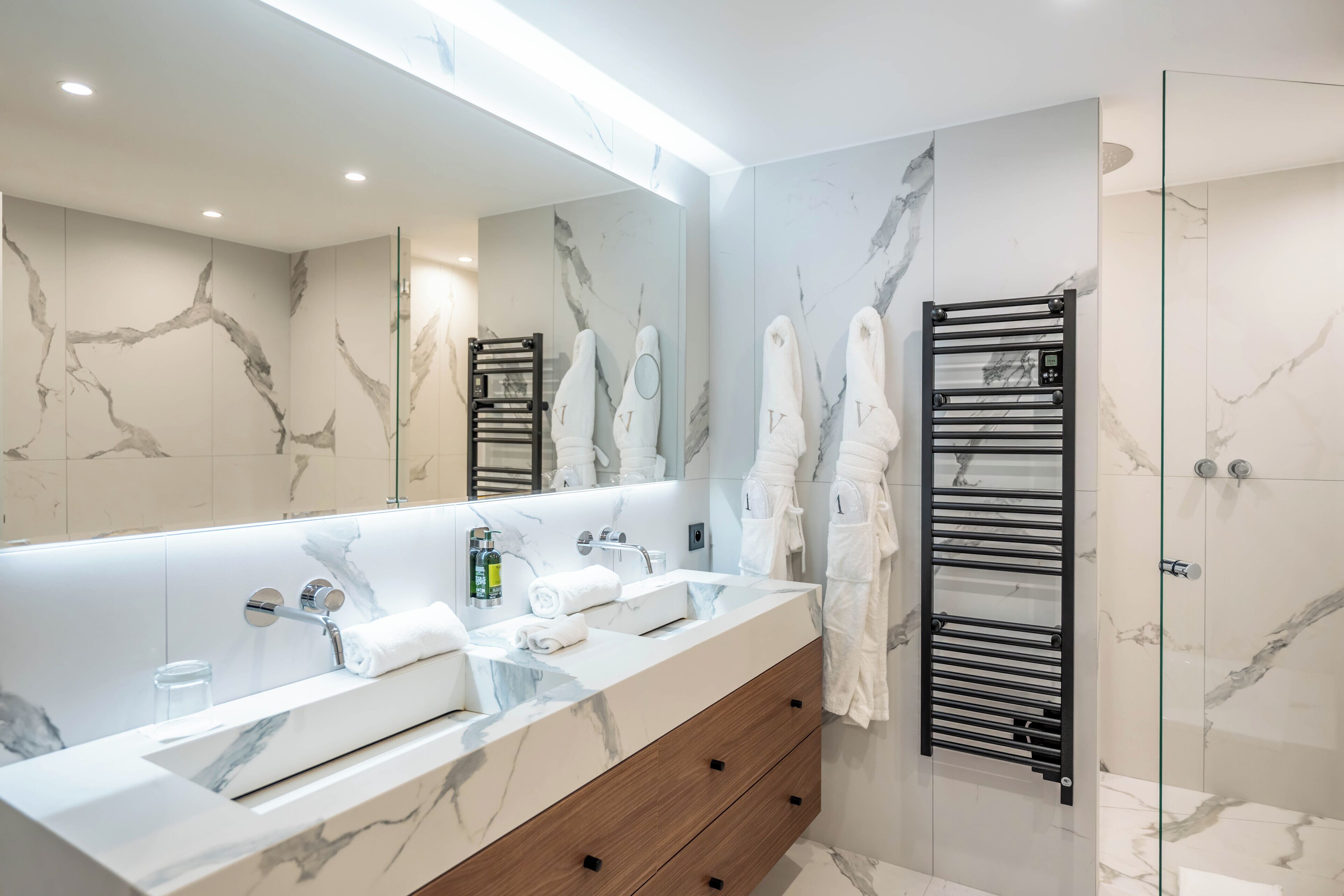 junior suite | bathroom | designer toiletries, hair dryer, bathrobes, towels