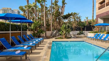 Outdoor pool, open 6:00 AM to 11:00 PM, pool umbrellas, pool loungers