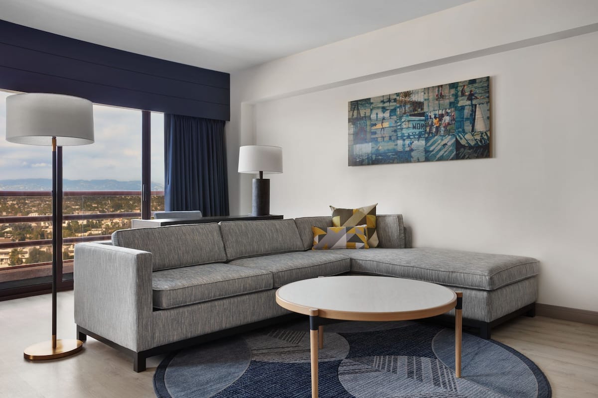 Executive Suite, 1 King Bed with Sofa bed, Non Smoking, City View | Living room | 32-inch Smart TV with cable channels, TV