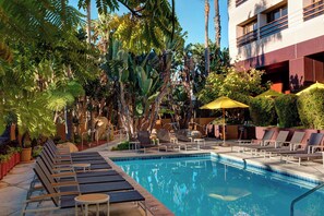 Outdoor pool, open 6:00 AM to 11:00 PM, pool umbrellas, sun loungers