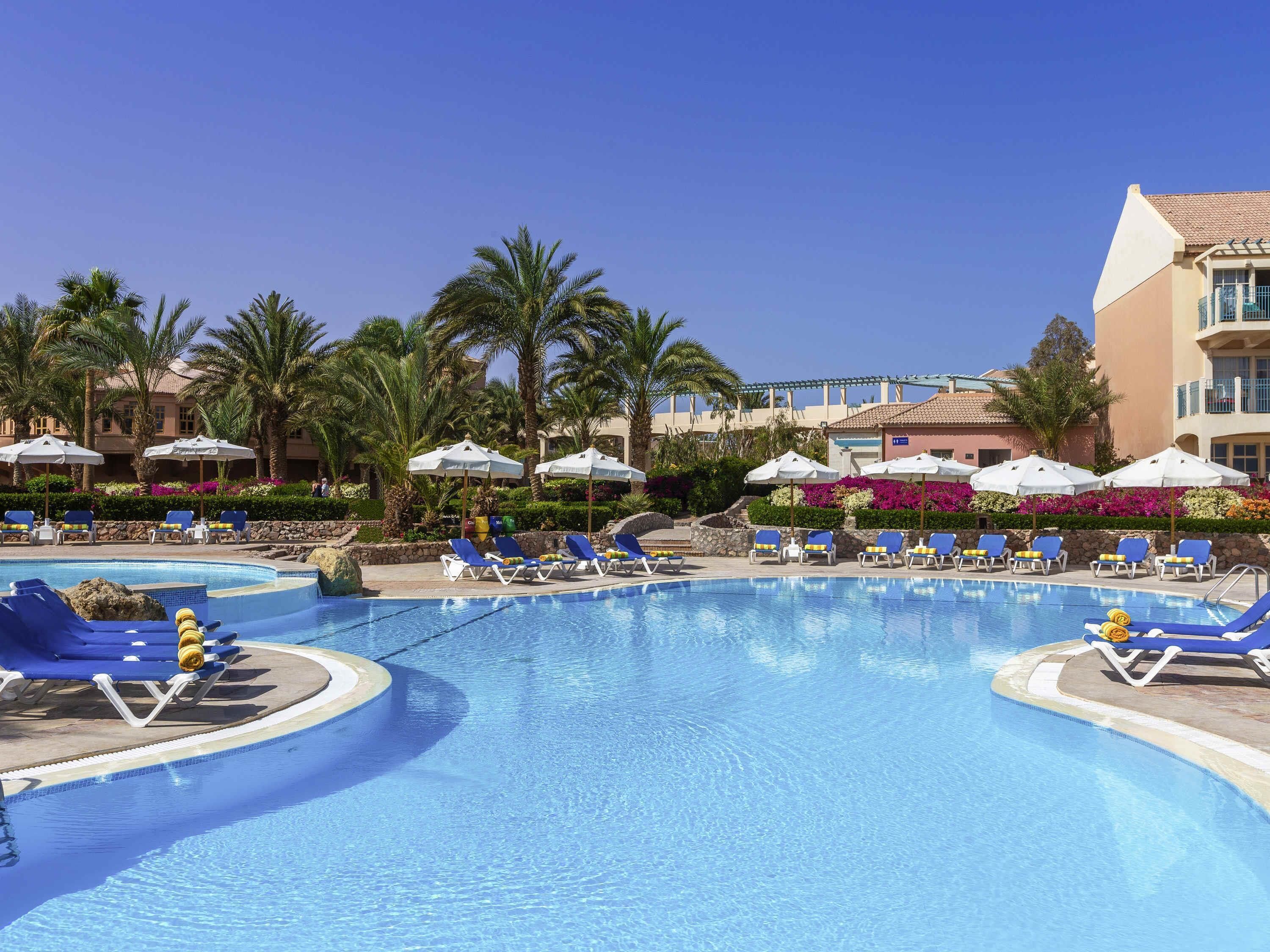 3 outdoor pools, open 7:00 AM to 5:00 PM, pool umbrellas, pool loungers