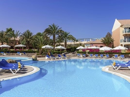 3 outdoor pools, open 7:00 AM to 5:00 PM, pool umbrellas, pool loungers