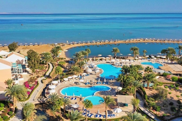 Private beach, beach umbrellas, beach towels, windsurfing