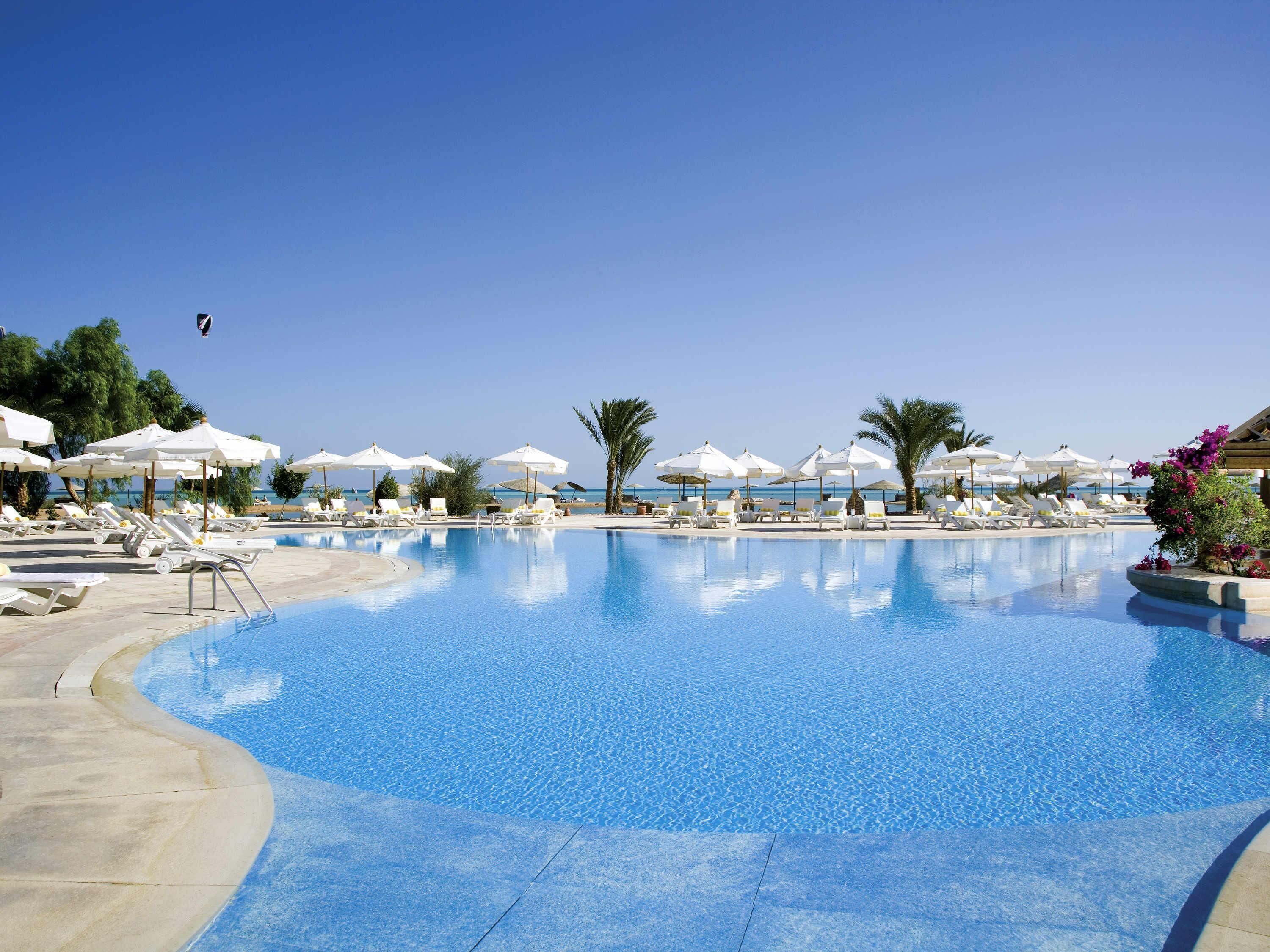 3 outdoor pools, open 7:00 AM to 5:00 PM, pool umbrellas, pool loungers