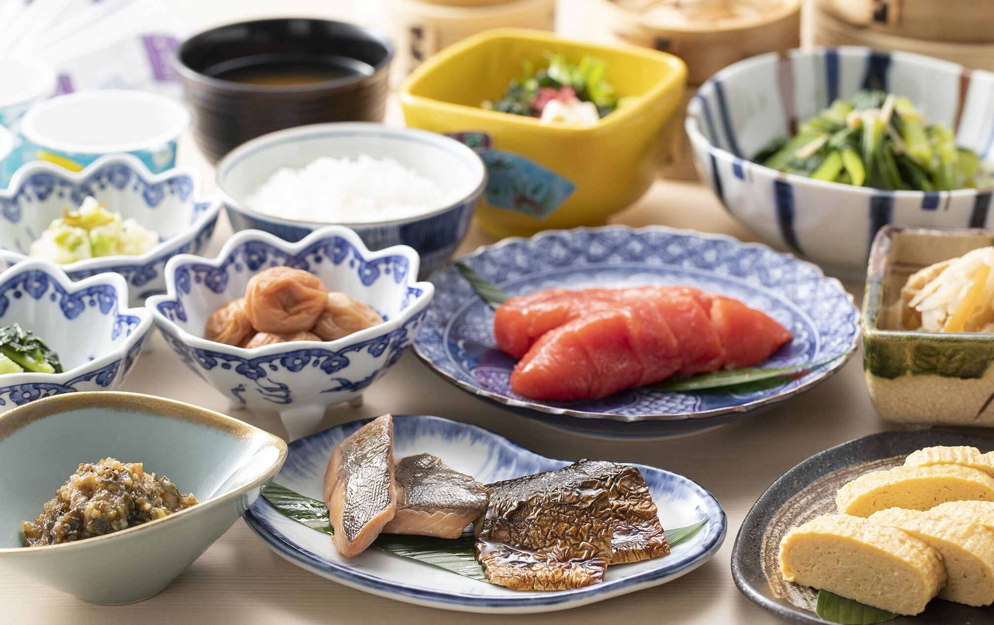 A variety of Japanese dishes including sushi, sashimi, and rice bowls.
