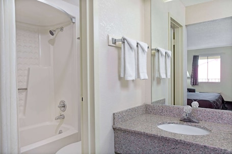 Combined shower/bathtub, free toiletries, hair dryer, towels. Super 8 by Wyndham Suwanee
