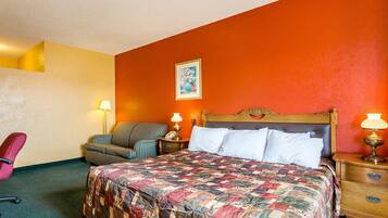 Desk, iron/ironing board, bed sheets
