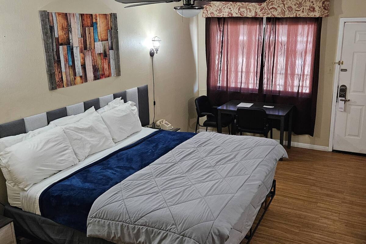 Room, 1 King Bed (Upstairs) | Desk, iron/ironing board, bed sheets