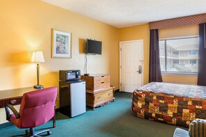 Desk, iron/ironing board, bed sheets