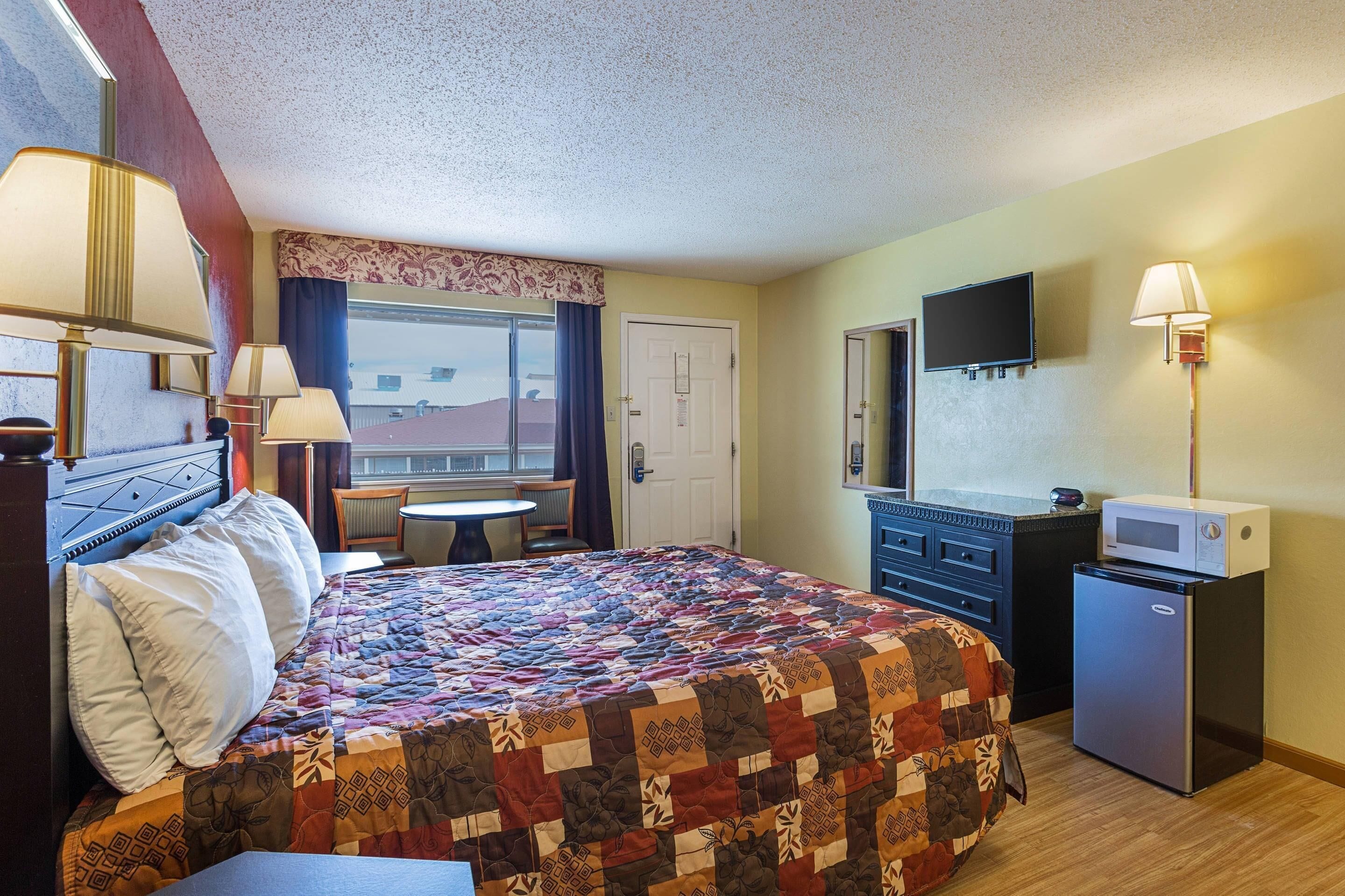 Room, 1 King Bed (Upstairs) | Desk, iron/ironing board, bed sheets