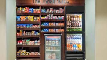 A snack and beverage vending area with a variety of snacks and drinks.