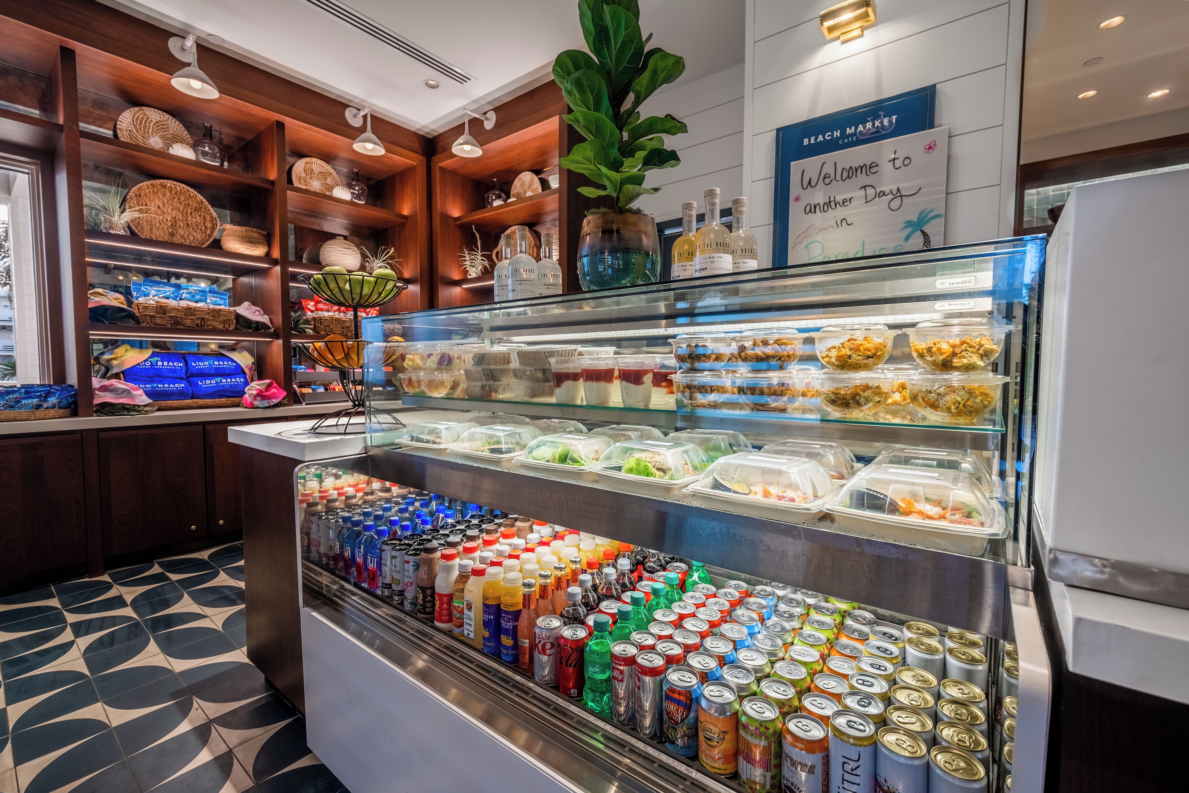 A buffet area with various food items and a selection of beverages.