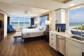 Hotel amenities such as safe, desk and work area at Lido Beach Resort