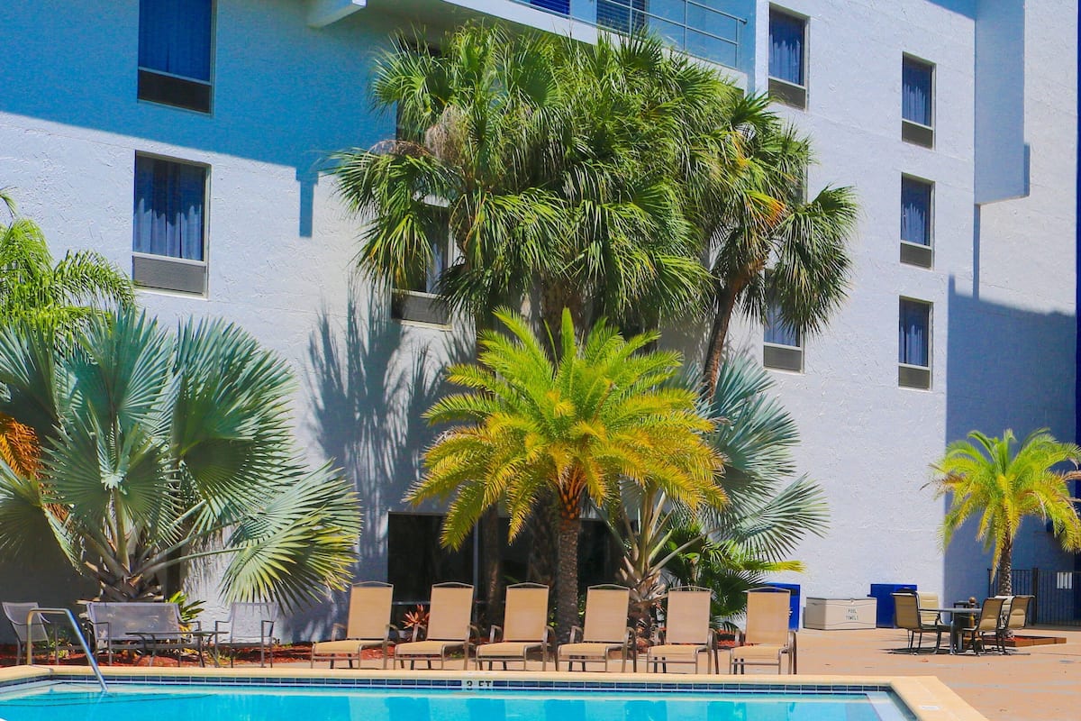 Room, 2 Queen Beds, Pool View | Premium bedding, down comforters, pillowtop beds, in-room safe