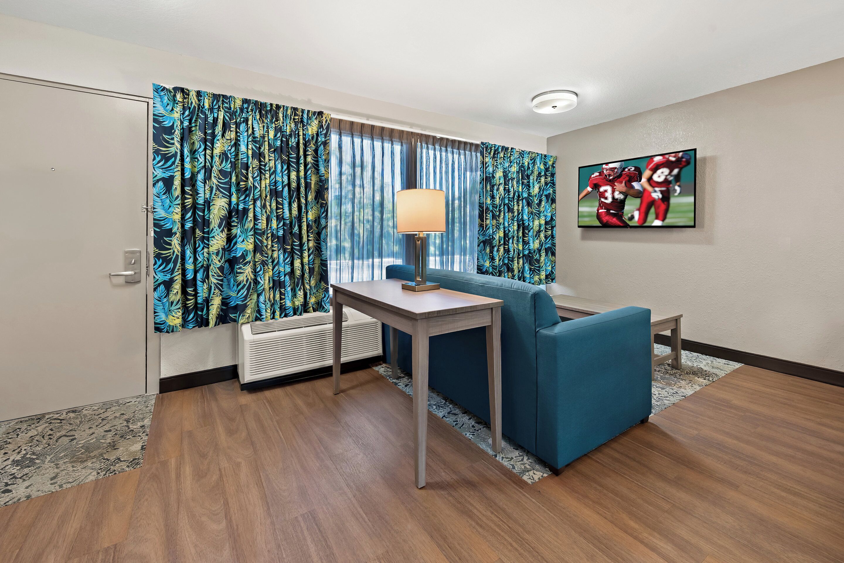 Desk, laptop workspace, blackout curtains, free WiFi