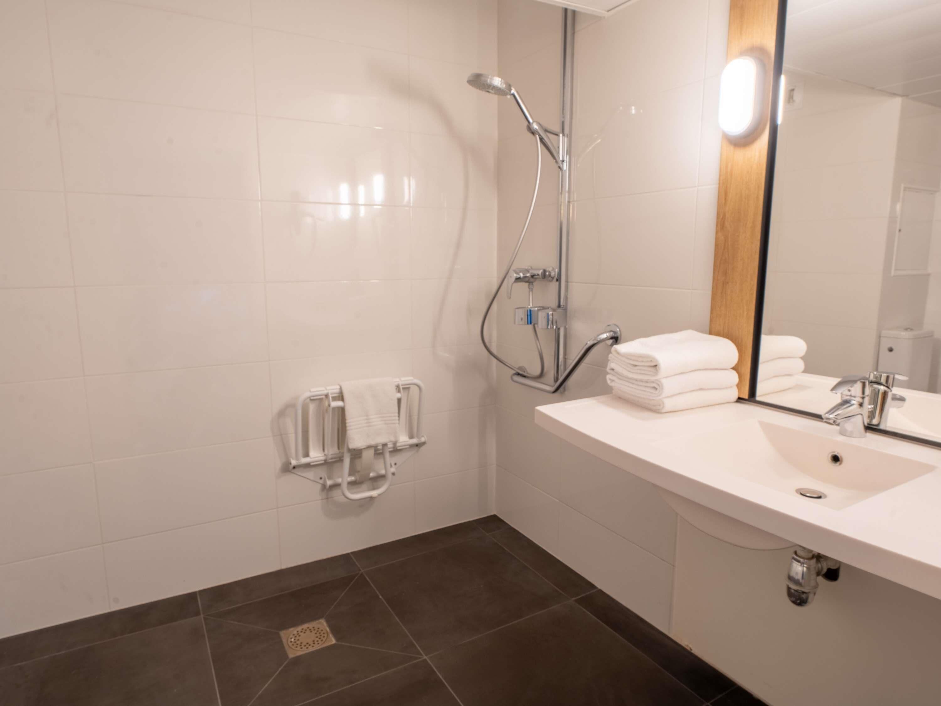 eco-friendly toiletries, hair dryer, towels