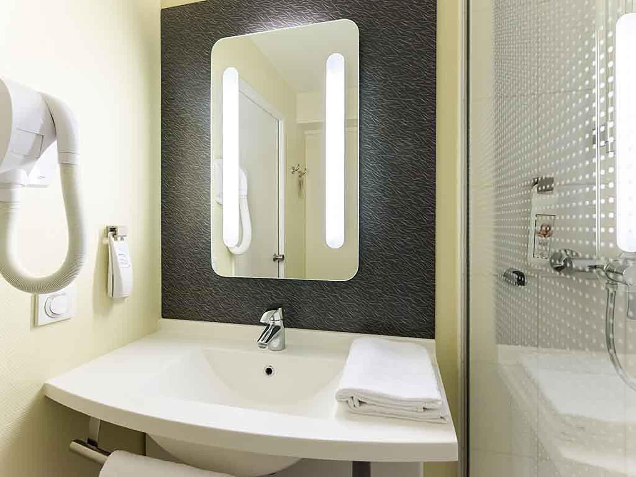 standard room, multiple beds | bathroom | eco-friendly toiletries, hair dryer, towels