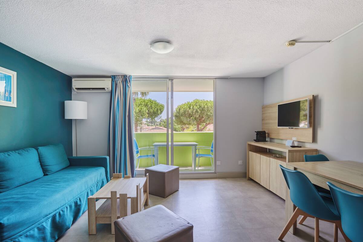 Apartment, 1 Bedroom | Living area | Flat-screen TV