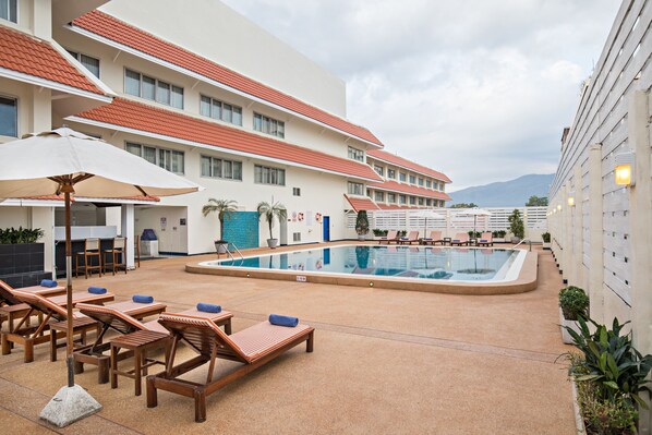 Outdoor pool, open 7:00 AM to 7:00 PM, pool umbrellas, pool loungers