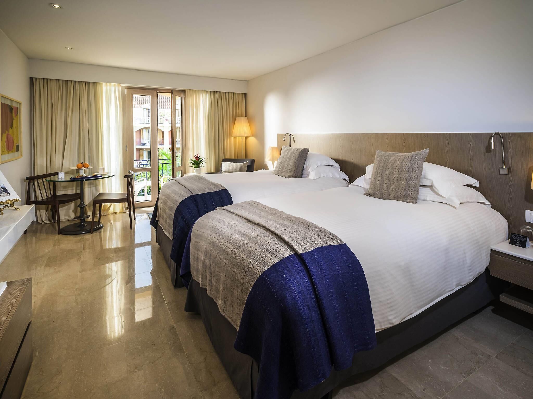 premium bedding, down duvets, minibar, in-room safe