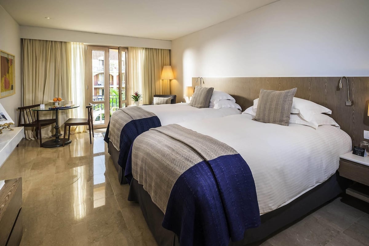 premium bedding, down duvets, minibar, in-room safe