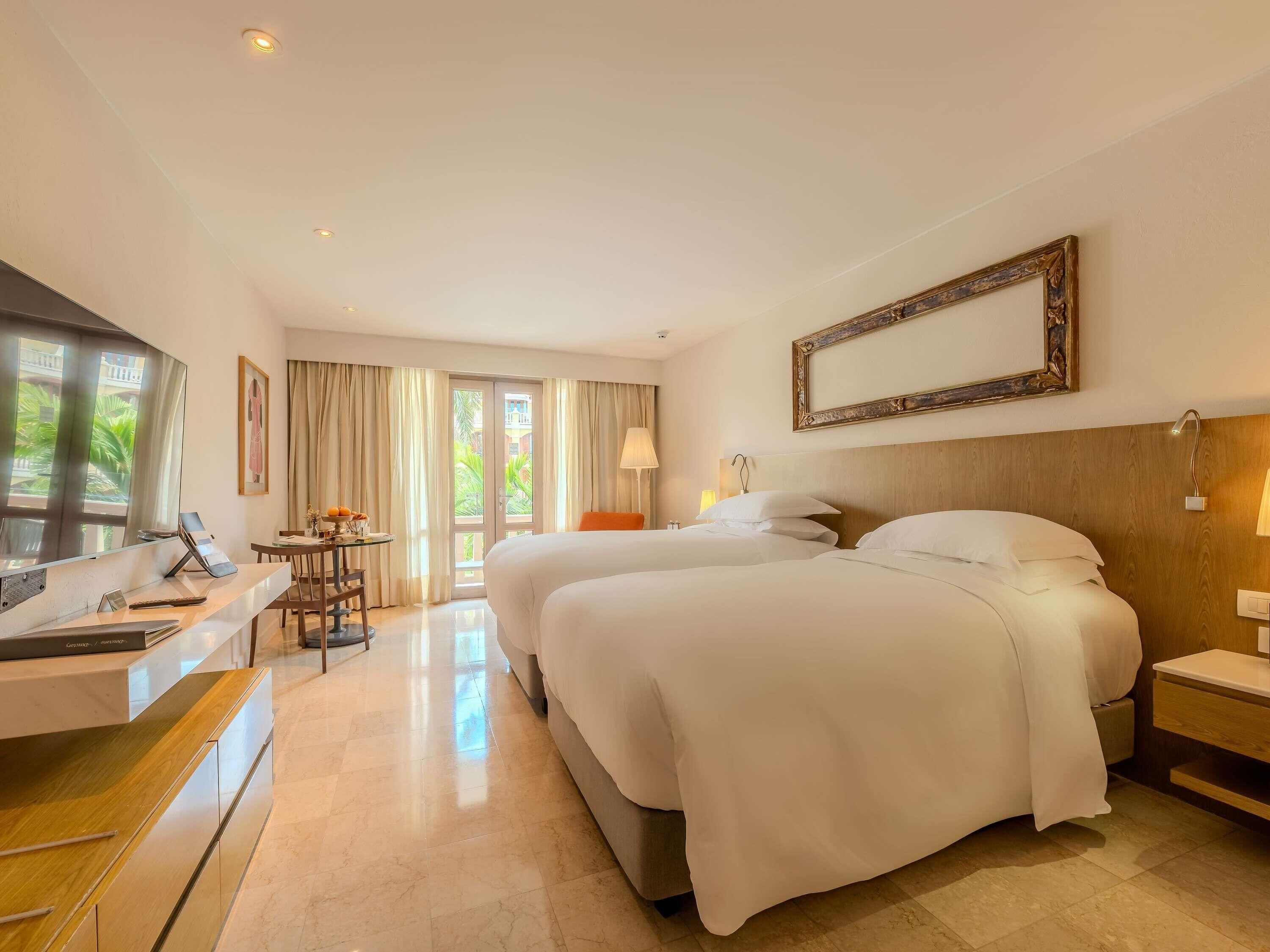 Premium bedding, down comforters, minibar, in-room safe