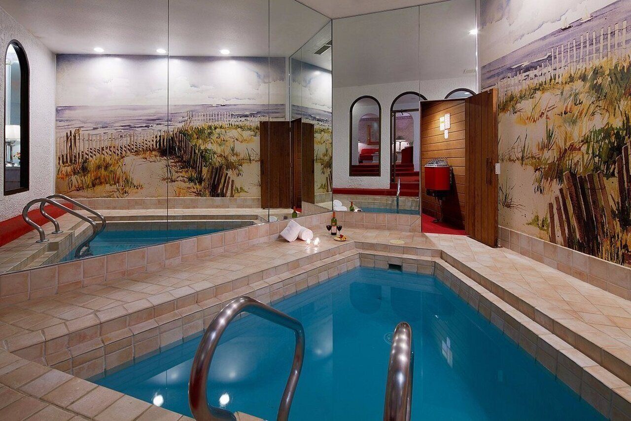 Indoor pool, outdoor pool, pool umbrellas, pool loungers