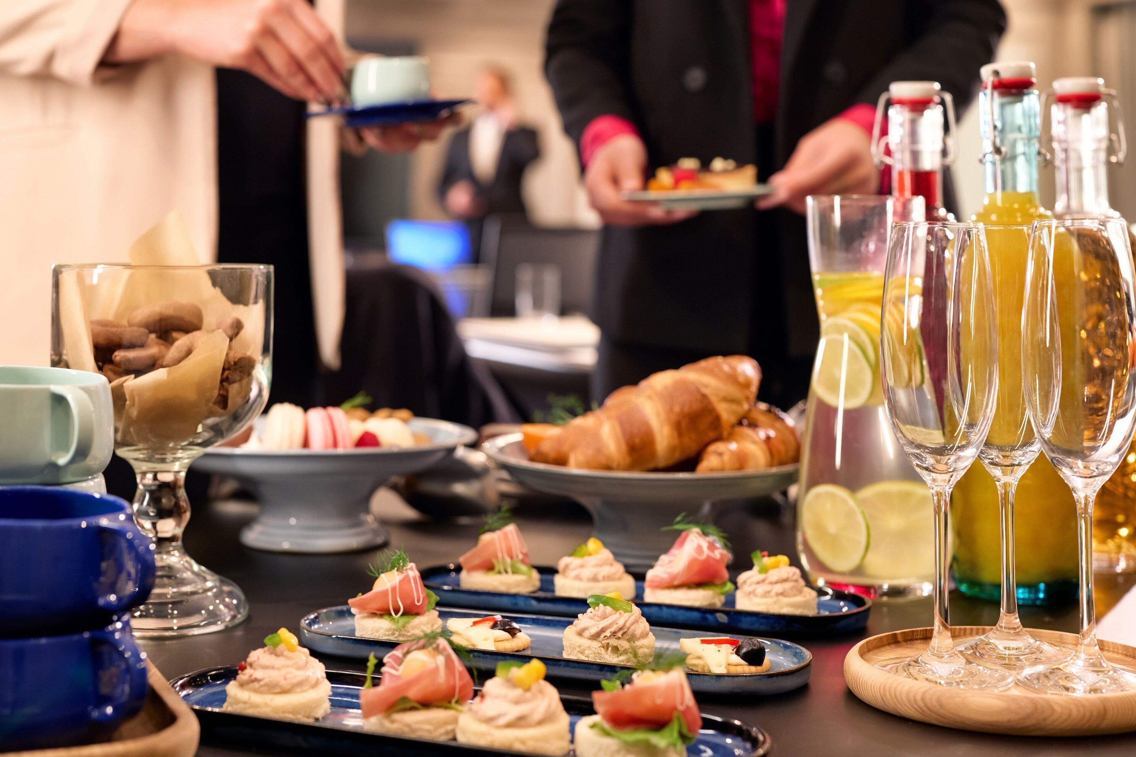 A buffet with various food items and drinks.