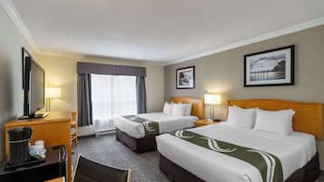 Pillowtop beds, desk, blackout drapes, iron/ironing board