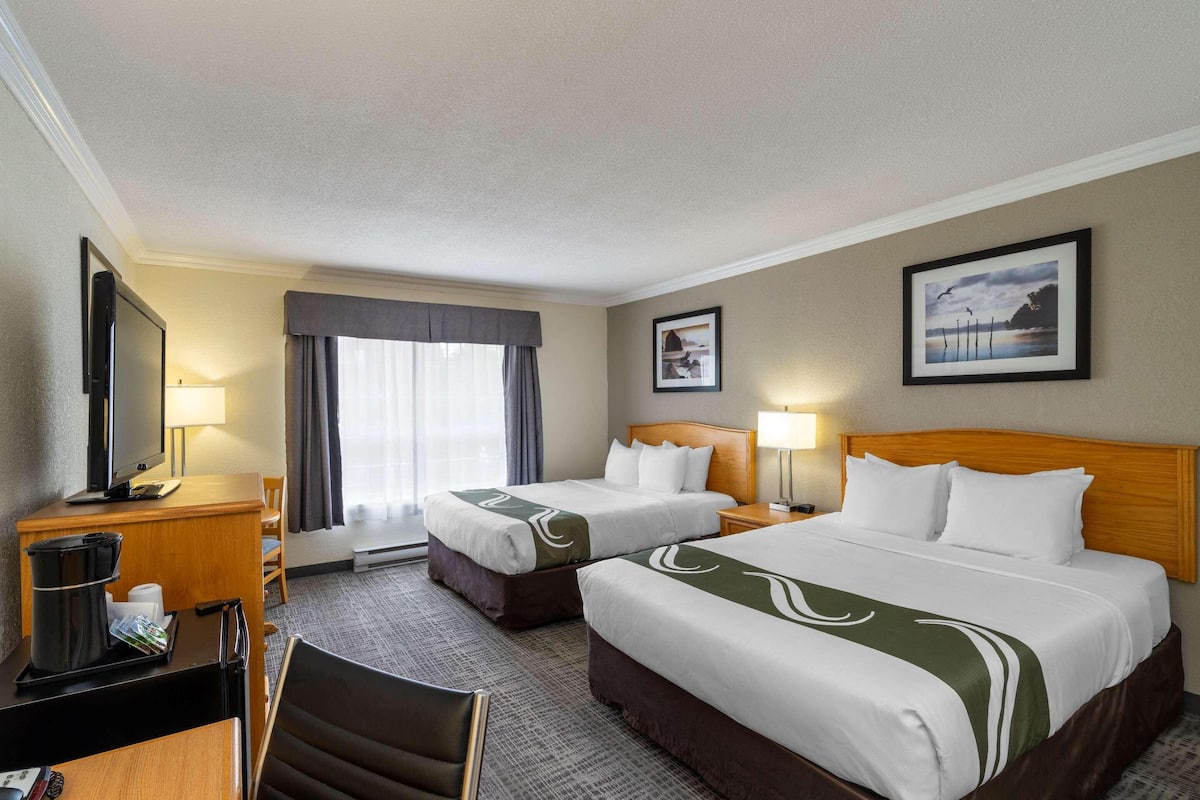 Pillow-top beds, desk, blackout curtains, iron/ironing board