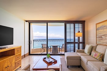 Hotel amenities such as safe, desk and work area at Royal Lahaina Resort & Bungalows