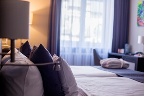 Hypo-allergenic bedding, pillow-top beds, in-room safe, desk