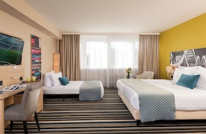 Comfort Triple Room | Minibar, individually decorated, desk, blackout drapes