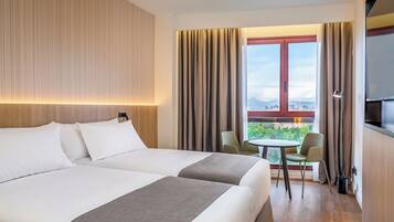 Luxe beddengoed, een minibar, een kluis op de kamer