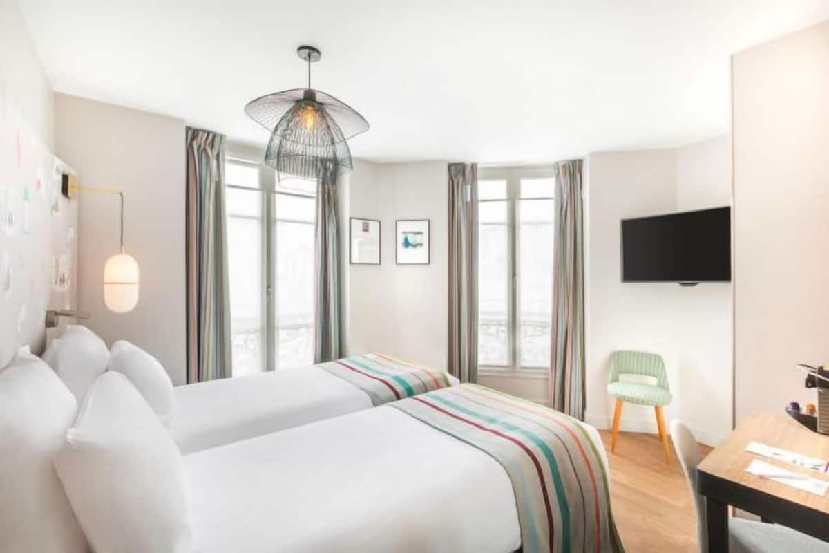 Luxe beddengoed, pillowtop-bedden, een kluis op de kamer, een bureau