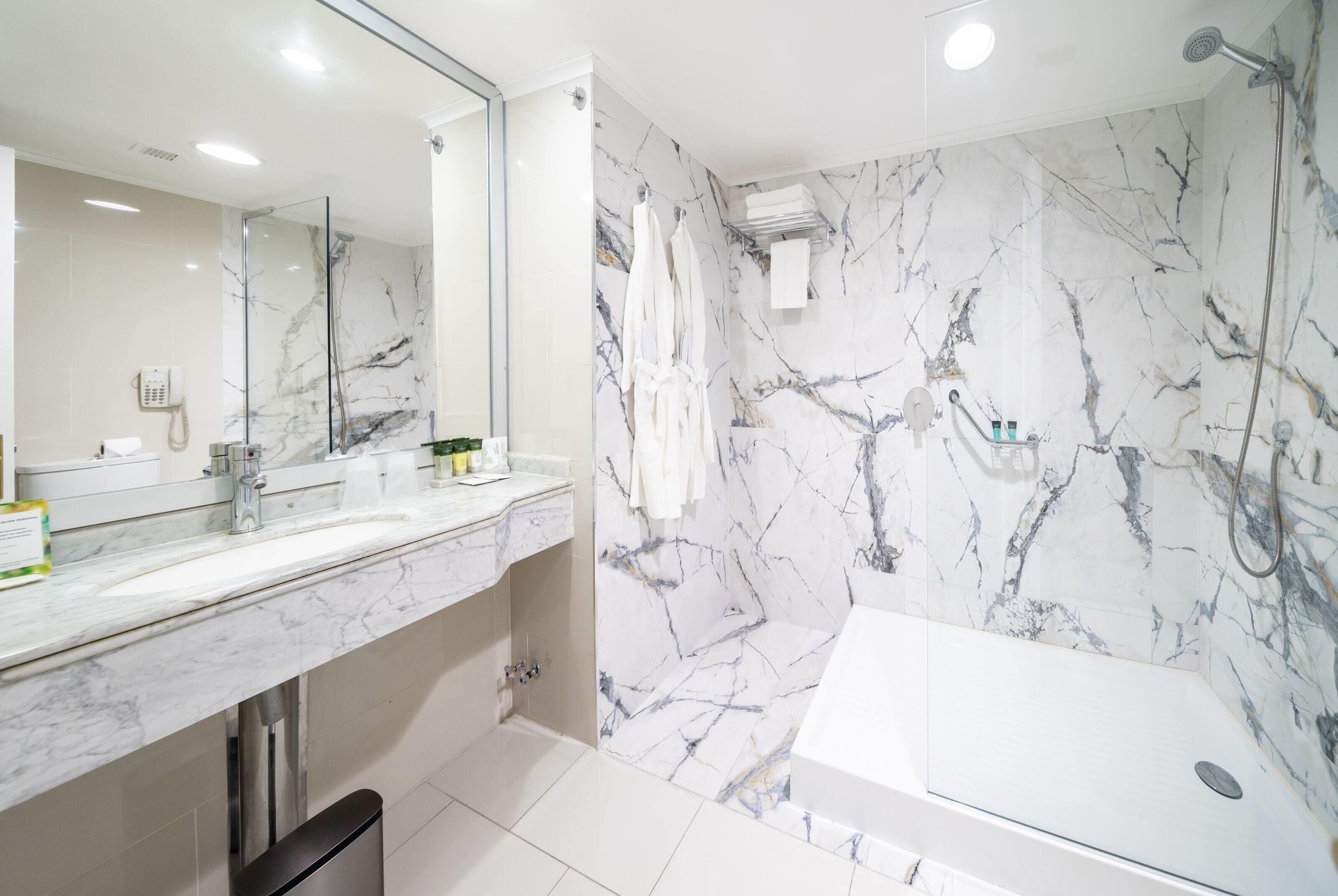 suite, 1 king bed, non smoking | bathroom | shower, rainfall showerhead, free toiletries, hair dryer