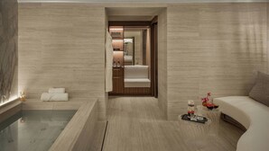 A modern bathroom with a bathtub, a shower area, and a vanity with a mirror. - Hotel d'Inghilterra Roma - Starhotels Collezione (Rome)