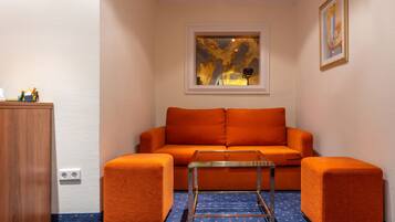 Standard Twin Room | Living room | Flat-screen TV