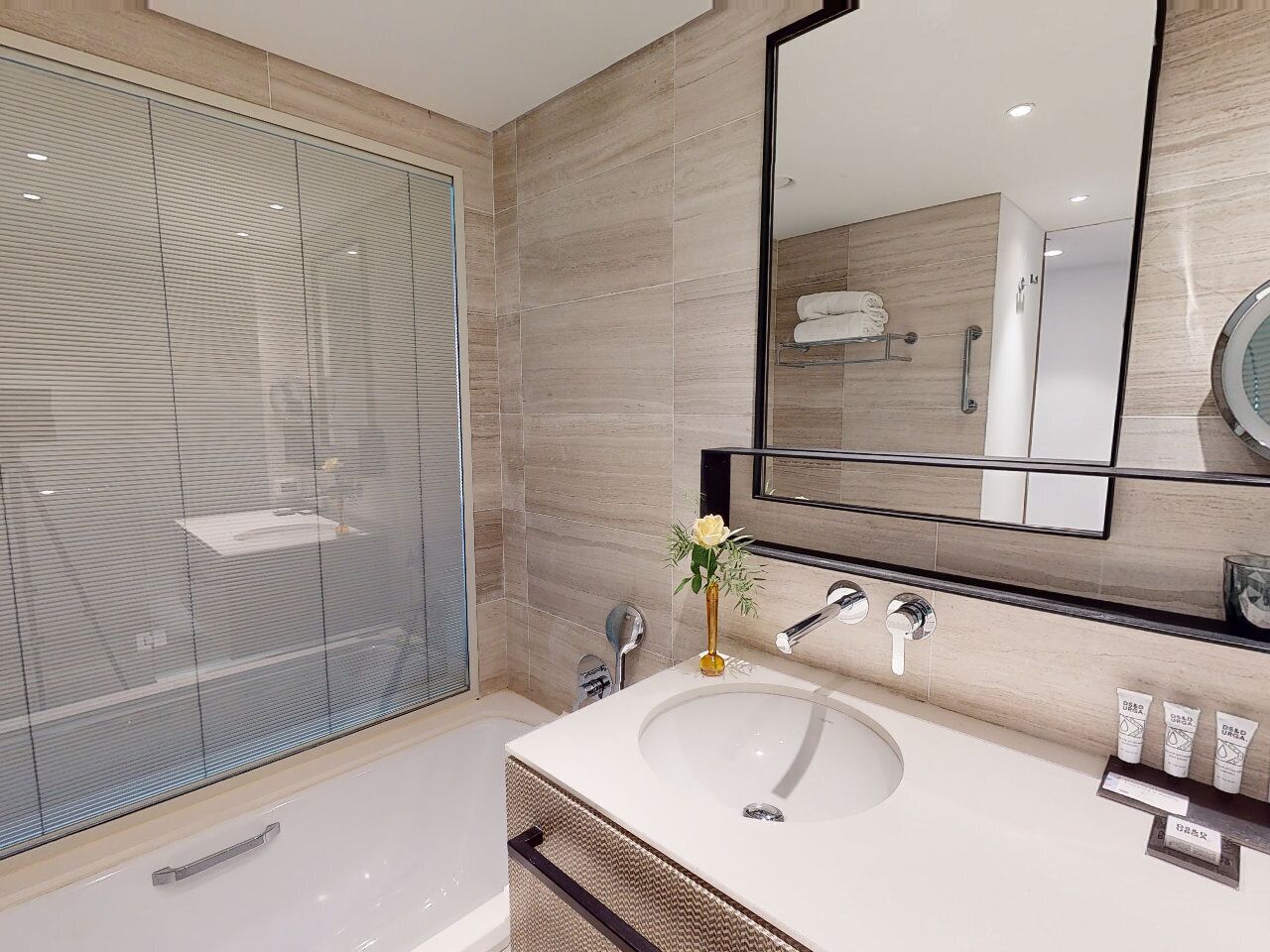 combined shower/bathtub, deep-soaking bathtub, designer toiletries