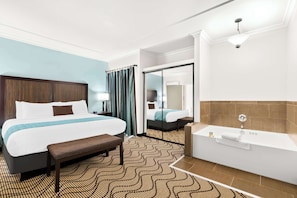 Suite, 1 King Bed, Jetted Tub, Corner | 1 bedroom, premium bedding, in-room safe, desk