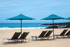 On the beach, sun loungers, beach umbrellas, beach towels