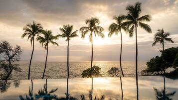 Outdoor pool, open 8 AM to 5 PM, pool umbrellas, pool loungers