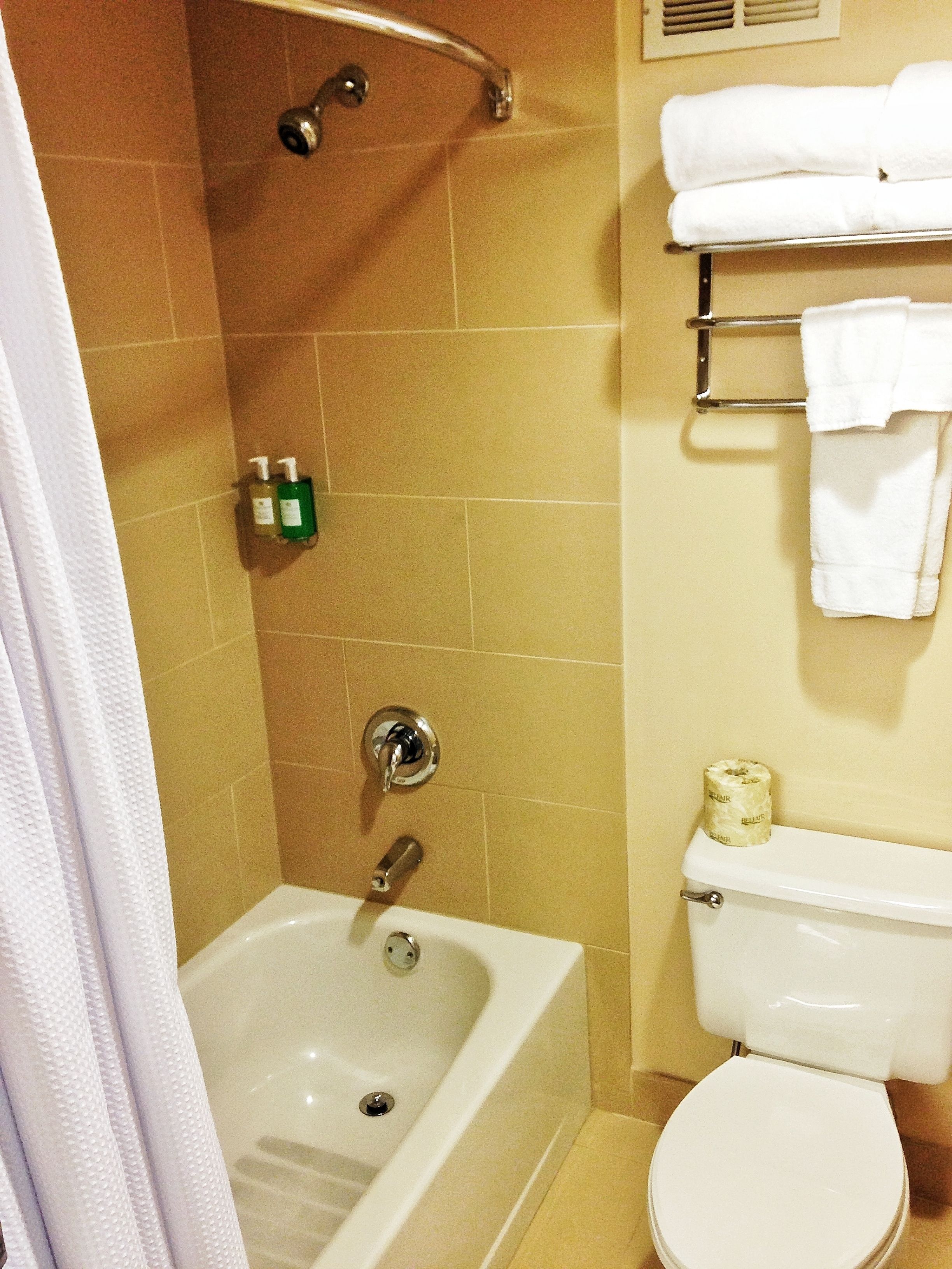 deluxe room (coast two queens) | bathroom | combined shower/bathtub, designer toiletries, hair dryer, towels
