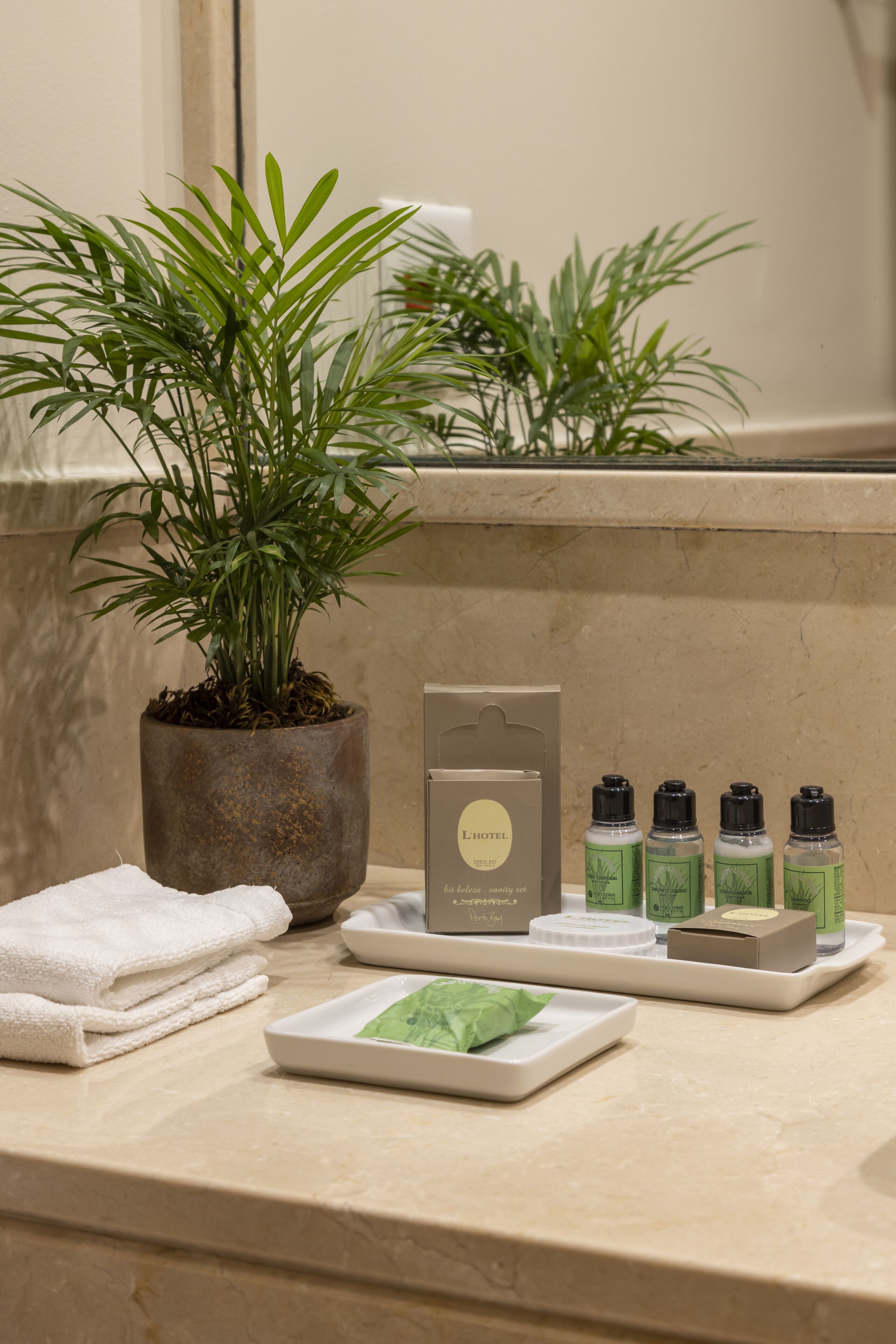 designer toiletries, hair dryer, bathrobes, slippers