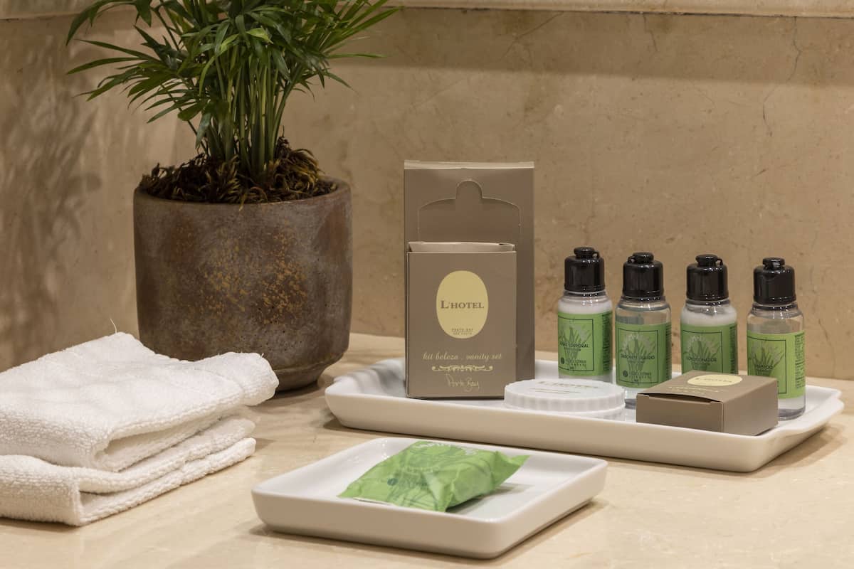designer toiletries, hair dryer, bathrobes, slippers