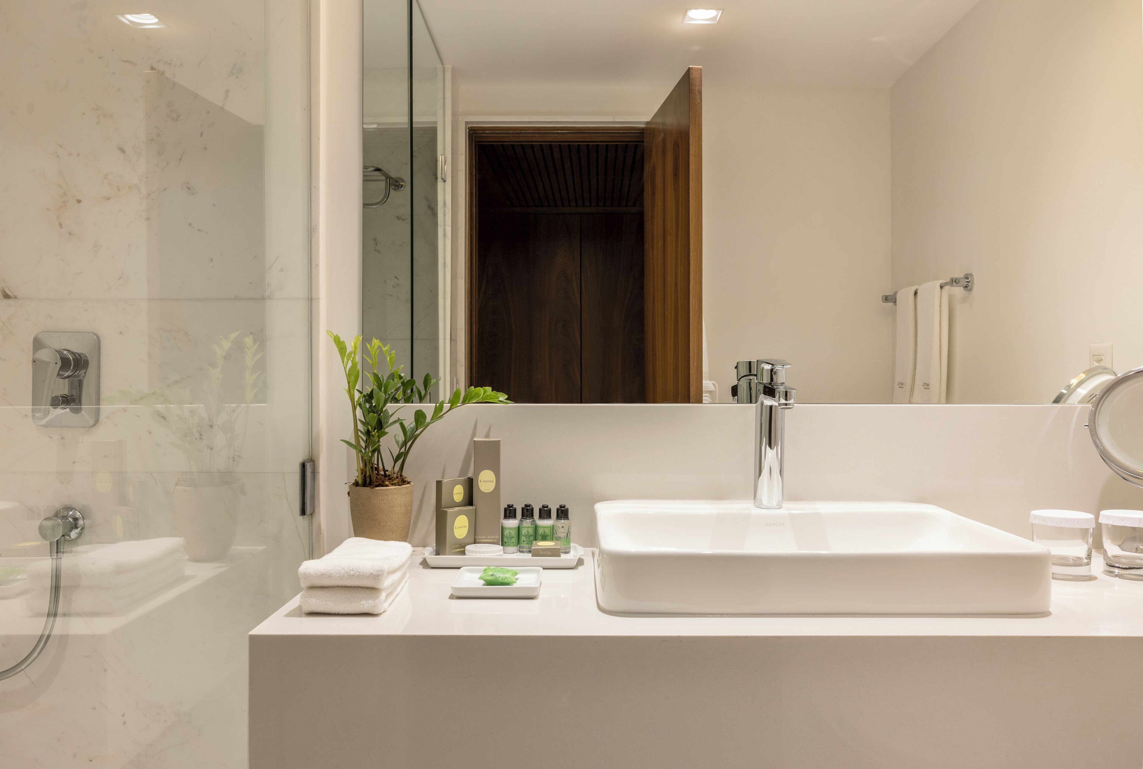 junior suite | bathroom | designer toiletries, hair dryer, bathrobes, slippers